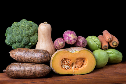 Vegetables over wooden table