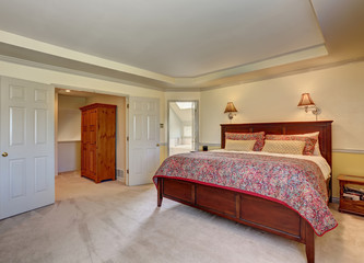 Bedroom interior with deep brown furniture and carpet floor