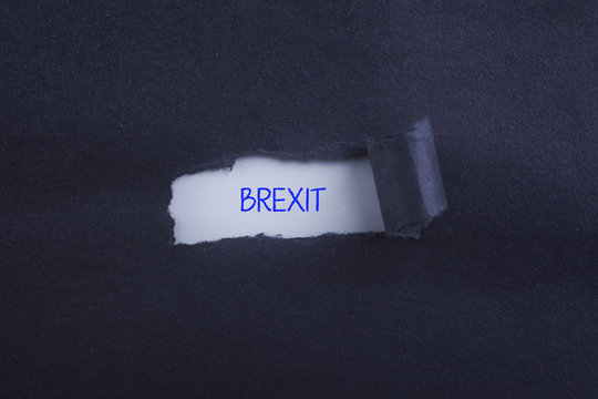 torn paper with BREXIT inscription.