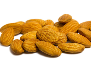 Almonds isolated on white with natural shadow
