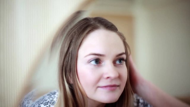 Young Woman Looking At Herself In Mirror