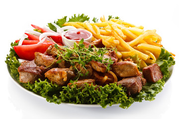 Kebab - grilled meat with French fries and vegetables