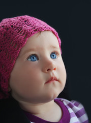 Child's portrait on black background