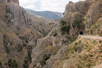 Road and the tunnel at the mountains on Crete island, Greece