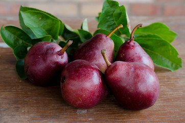 ripe pears on wooden table