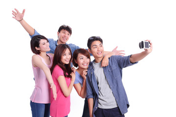  teenagers taking pictures by themselves