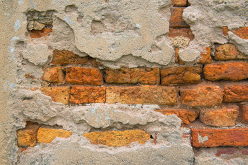 the Orange brick and  cement old wall. 