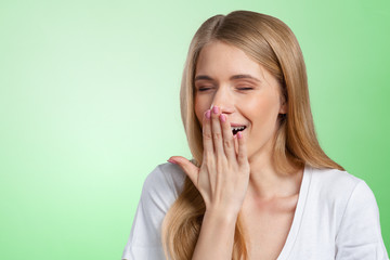 Young girl yawning