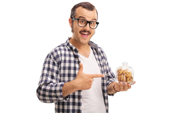 Man holding a jar of cookies