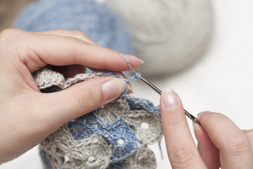 Handmade crocheted with crochet hook in hand