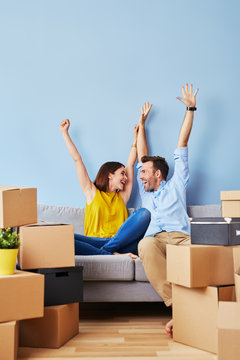 Excited couple moving to new apartment