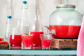 Watermelon drink in glasses with slices of watermelon mint and lemon, vintage background ,soft focus