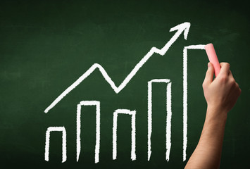 Hand drawing graph on blackboard