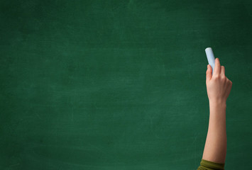 Hand writing on clean blackboard