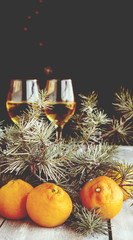 Fototapeta na wymiar Christmas balls with fir branches and glasses of champagne