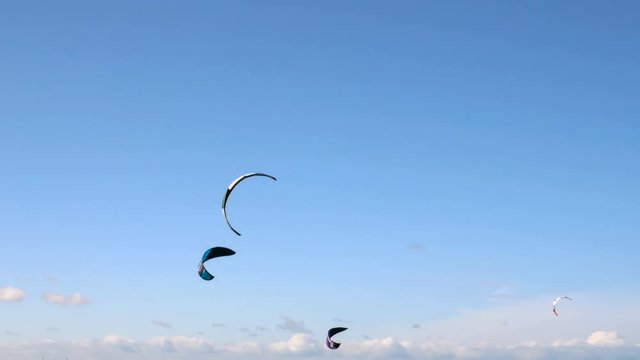 Kite Surfing in Ocean, Extreme summer sport. Kite Boarding in Baltic Sea. Clip contains: kitesurfing, kiteboarding, ruegen, water, surfer, beach	
