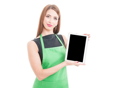 Pretty young employee holding tablet