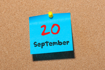 September 20th. Day 20 of month, color sticker calendar on notice board. Autumn time. Empty space for text