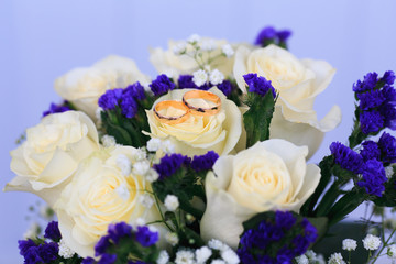 wedding rings on flowers. wedding. newlyweds. gold rings. Lord of the Rings. gold.
