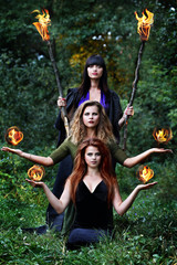 three witches with balls of fire