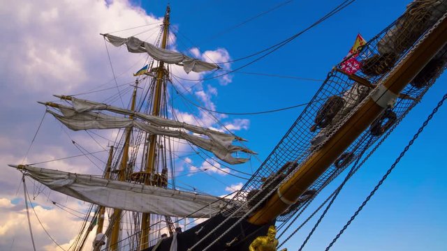 Clouds over the Masts of Sailing Ship. Time Lapse. 4K.