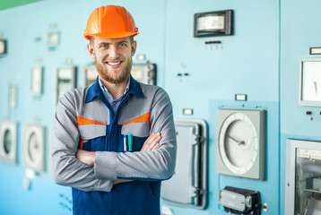 young happy engineer at control room