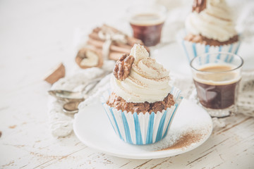 Carrot cake cupcakes with butter cream frosting