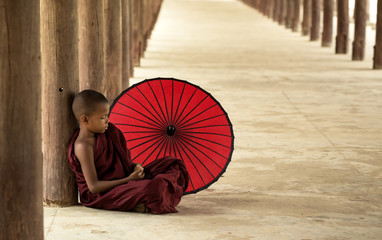 Little monk sleeping in the pagoda