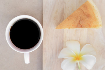Cup of black coffee and Pieces of Japanese style Cheesecake with