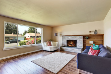 Modern living room interior with fireplace and hardwood flo