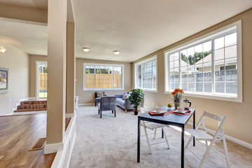 Hallway interior in beige walls. Living room with modern blue sofa