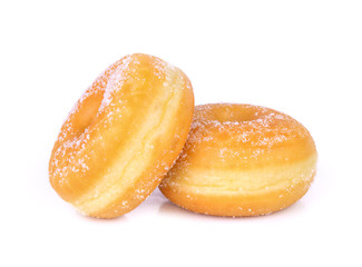 Two stacked sugared donuts over white background