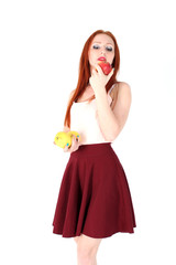 beautiful young woman holding an apple