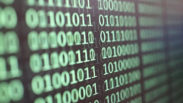 Green binary code on LCD computer screen. Digital technology concept.