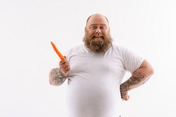 Man holding a carrot