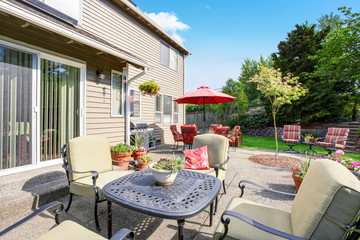 Well kept garden at backyard with concrete floor patio area