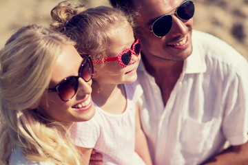 happy family in sunglasses on summer beach