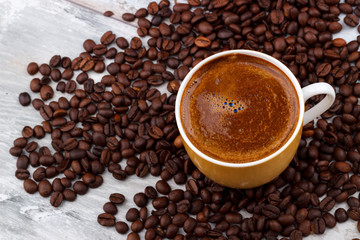 Coffee cup with roasted beans