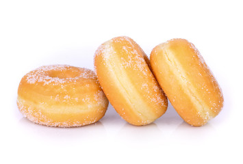 sugared donuts over white background
