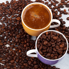 Coffee cup with roasted beans