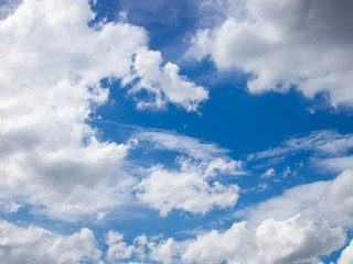 Clear blue sky with white cloud background