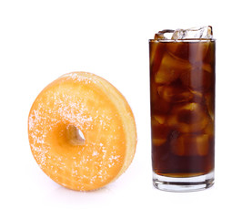 Fresh coke in glass and sandwich cookies isolated on a white bac