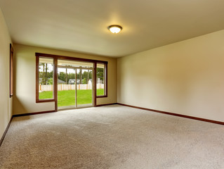 Empty room interior in beige tones and carpet floor.