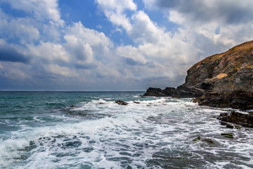 Waves crashing against boulders