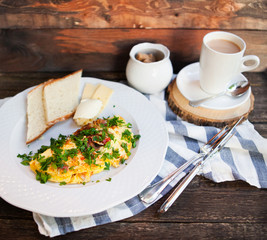 Latte cap and Herb omelette with chives and oregano sprinkled wi