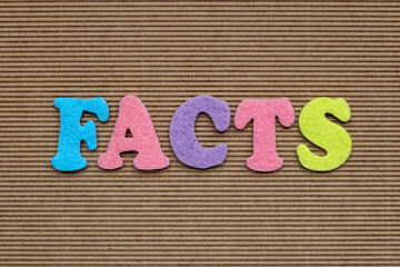 facts word on cardboard background