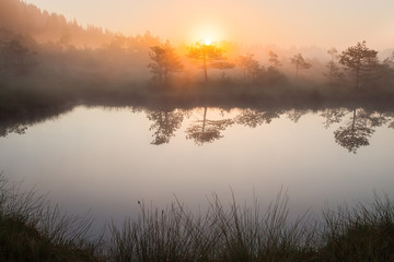 Beautiful sunrise next to Saint Anna lake in Transylvania