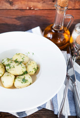 Hot boiled potato on rustic background