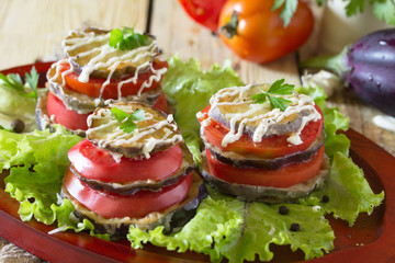 Fried eggplant a stack of folded with tomato, garlic and cream s