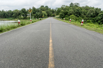 Asphalt road with yellow line